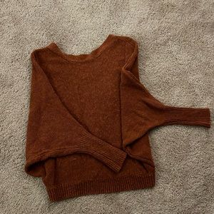Medium burnt red/orange sweater with buttons down the back